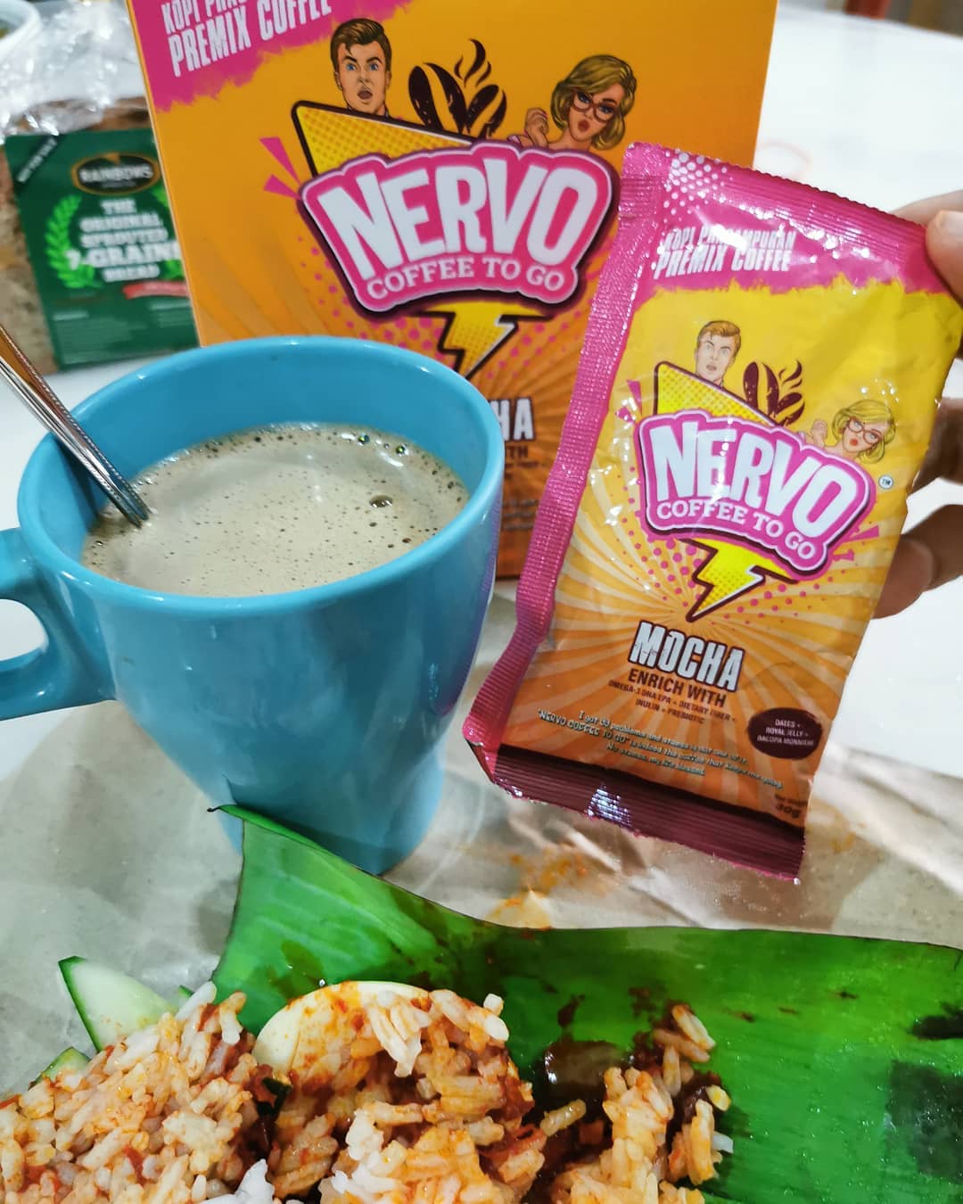 nasi lemak with a cup of coffee and a package of Nervo Coffee